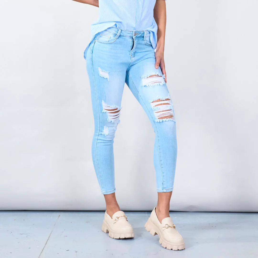 Distressed skinny jeans with ripped details wholesale