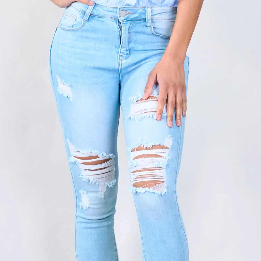 Distressed skinny jeans with ripped details wholesale