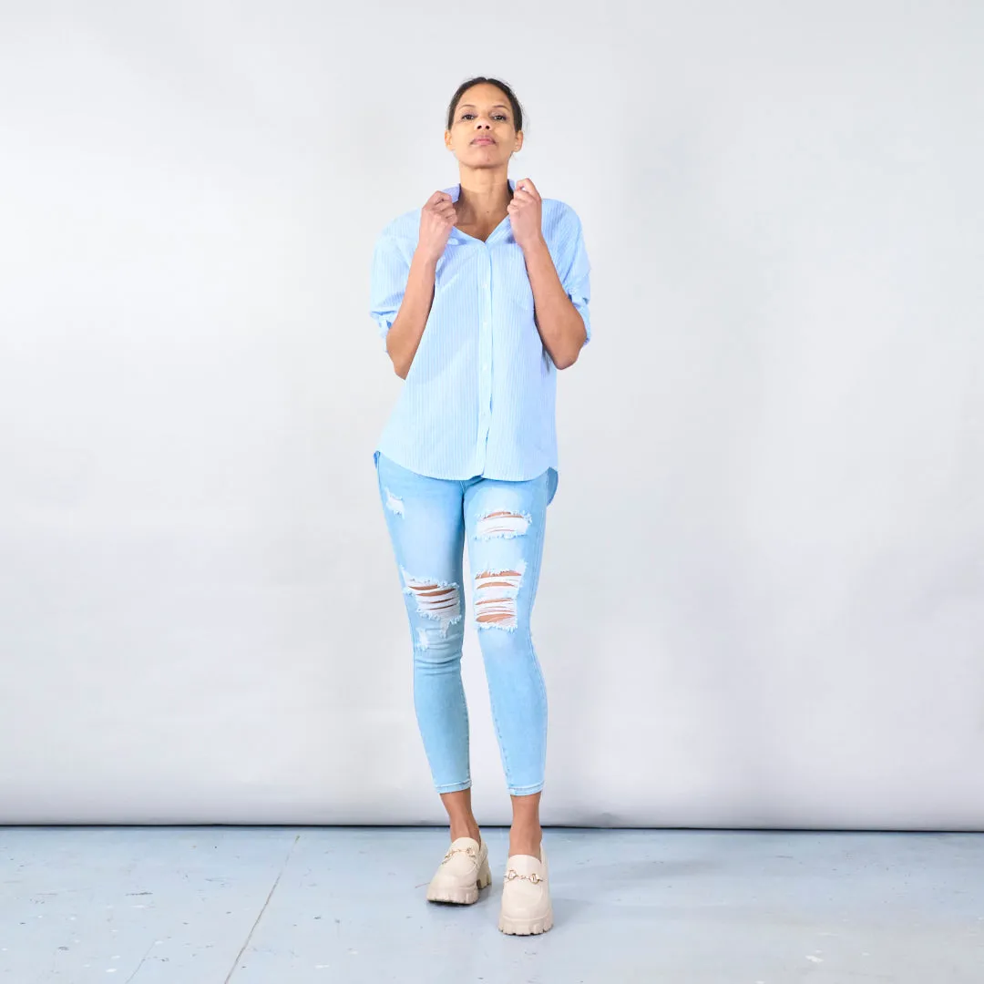 Distressed skinny jeans with ripped details wholesale