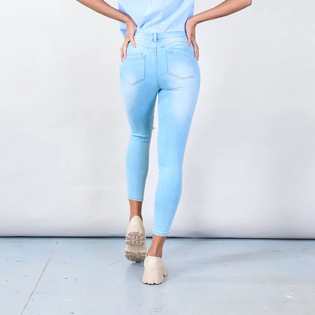 Distressed skinny jeans with ripped details wholesale