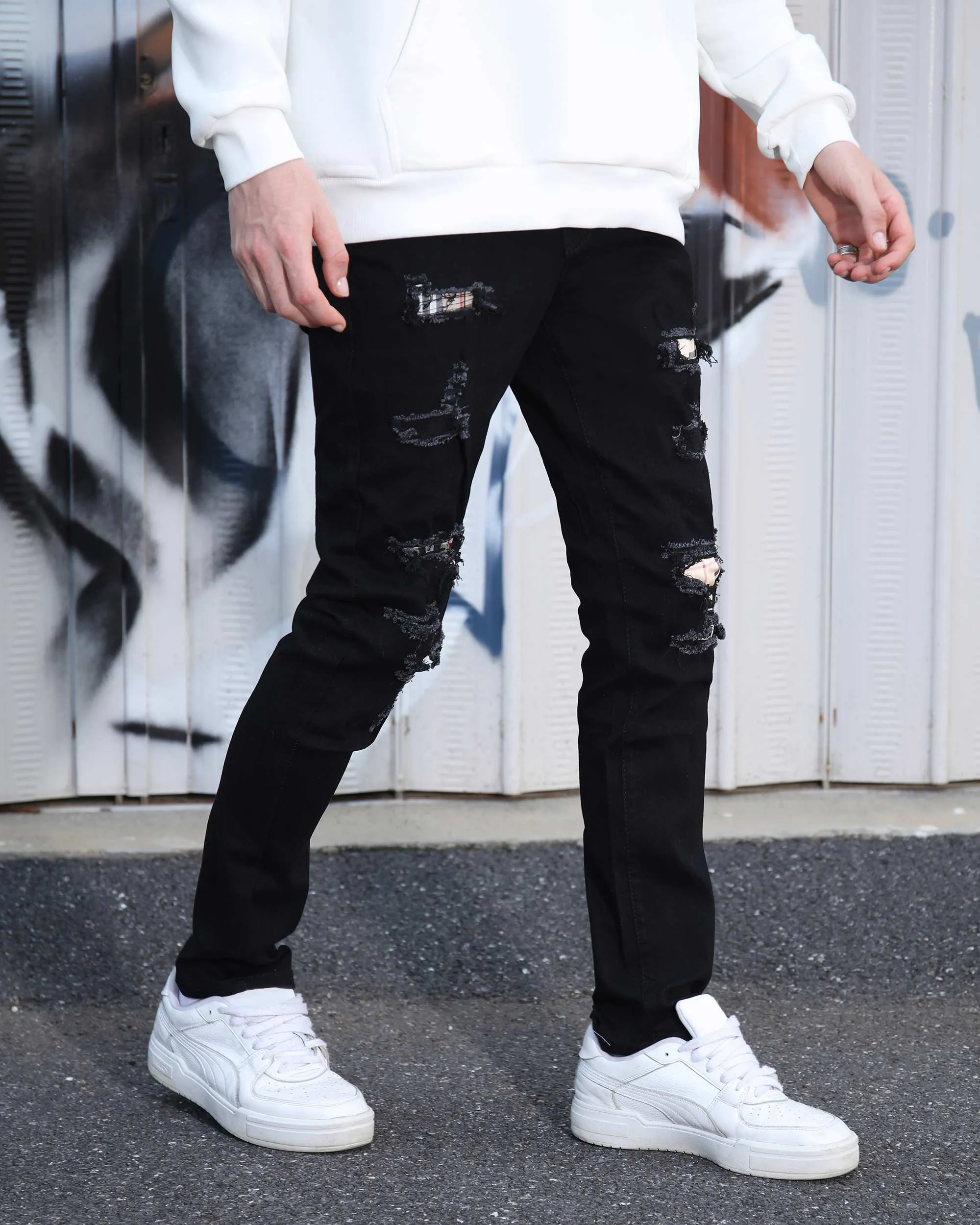 Simple & Stylish Black Ripped Jeans with Classic Plaid Patch