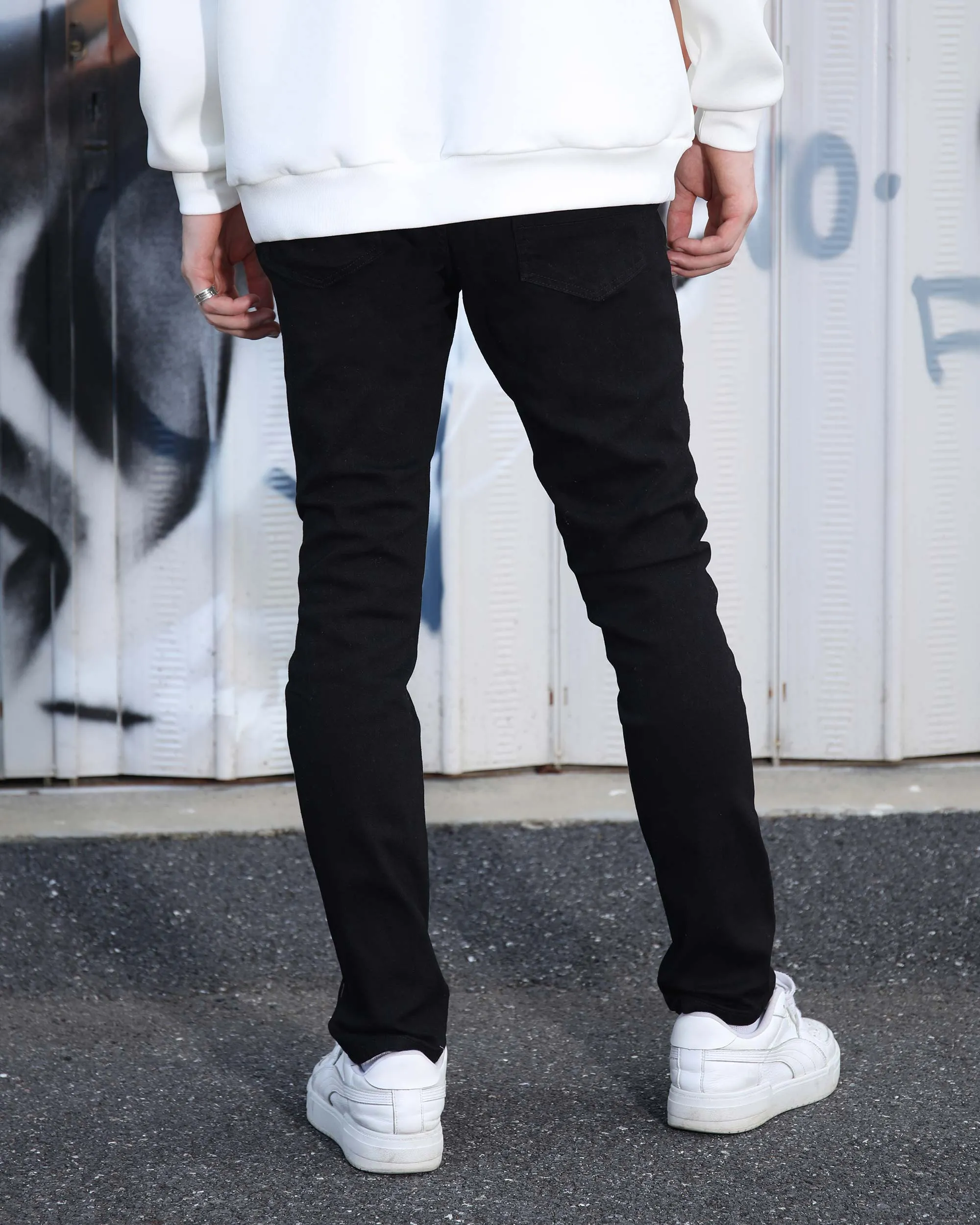 Simple & Stylish Black Ripped Jeans with Classic Plaid Patch