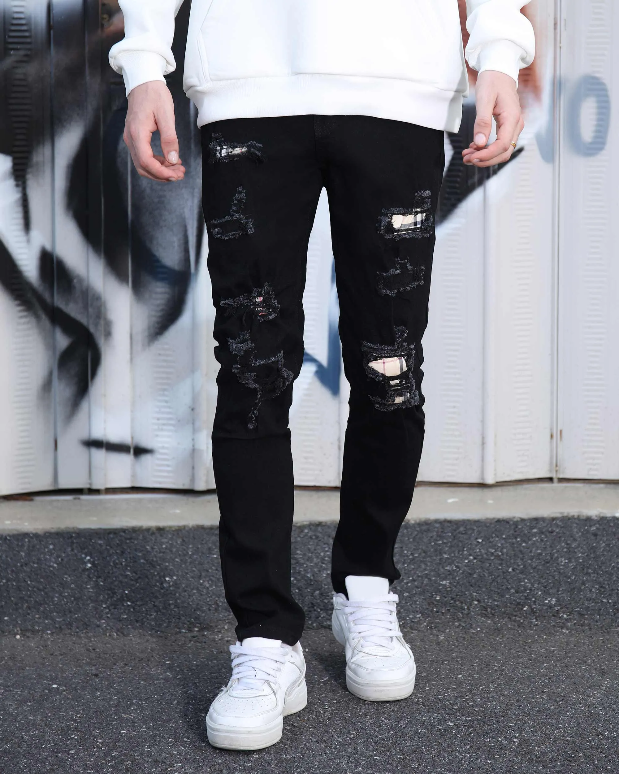 Simple & Stylish Black Ripped Jeans with Classic Plaid Patch