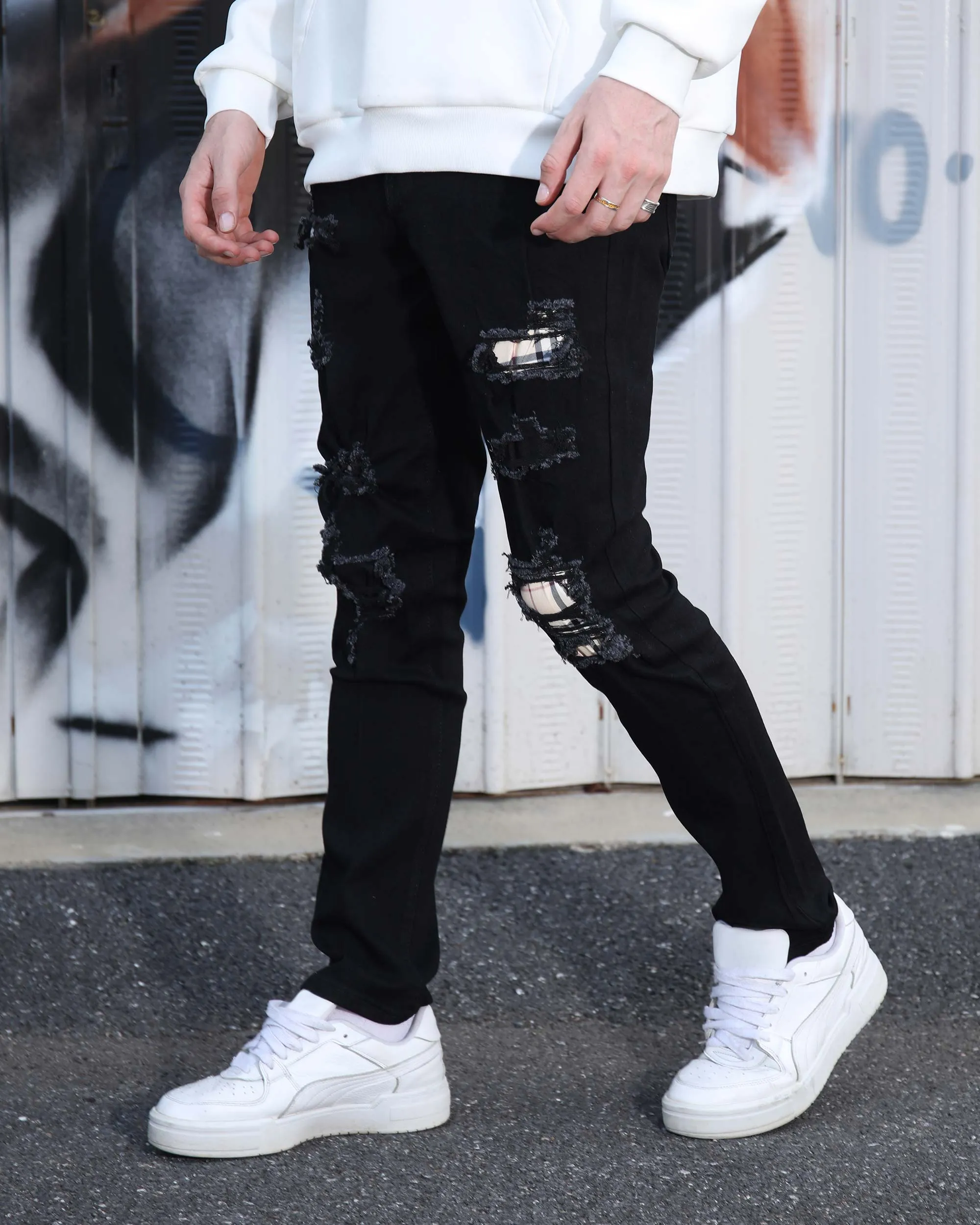 Simple & Stylish Black Ripped Jeans with Classic Plaid Patch